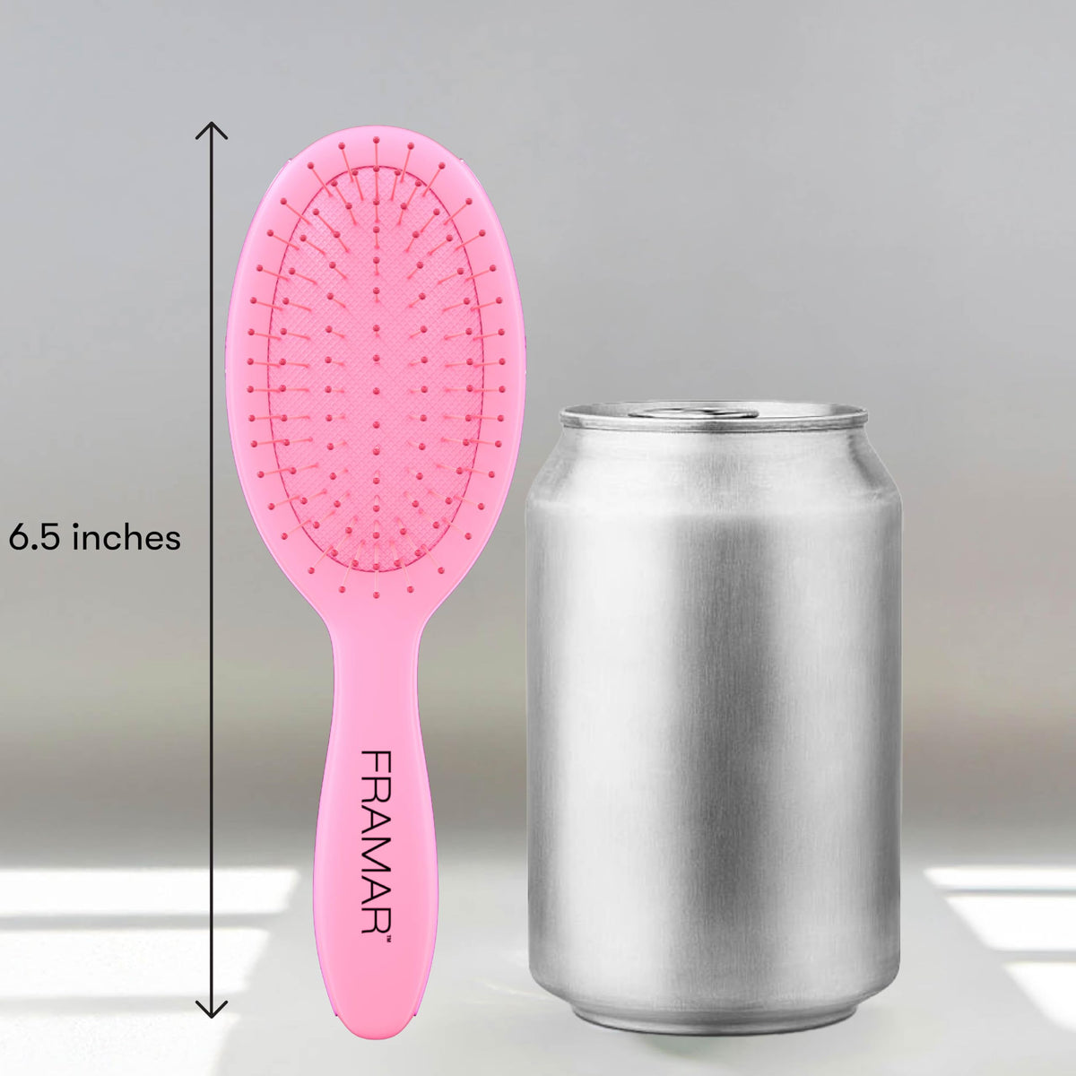 FRAMAR Mini Hair Brush Detangler displayed on a vanity
