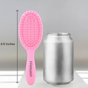 FRAMAR Mini Hair Brush Detangler displayed on a vanity