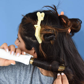FRAMAR Pastel Alligator Hair Clips displayed in a salon setting