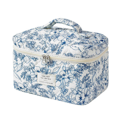 Front view of uekeboag Large Travel Quilted Makeup Bag in navy blue floral design