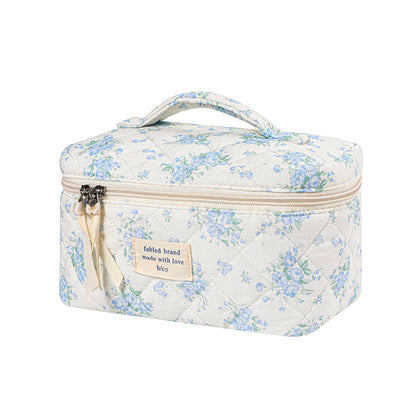 Front view of uekeboag Large Travel Quilted Makeup Bag with floral pattern