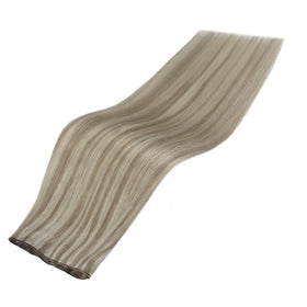 Full Shine Genius Weft Hair Extensions displayed on a table