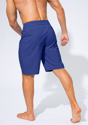 G Gradual Men's Swim Trunks blue on a beach