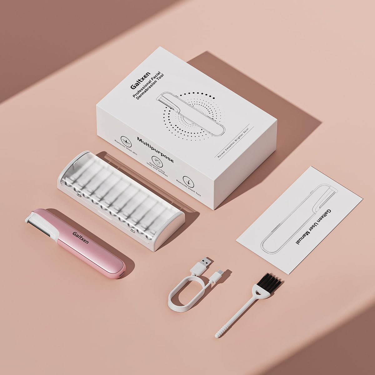 Galtxen Dermaplaning Tool pink packaging on a flat surface
