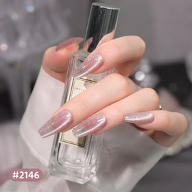 GAOY Cat Eye Magnet next to gel nail polish bottles