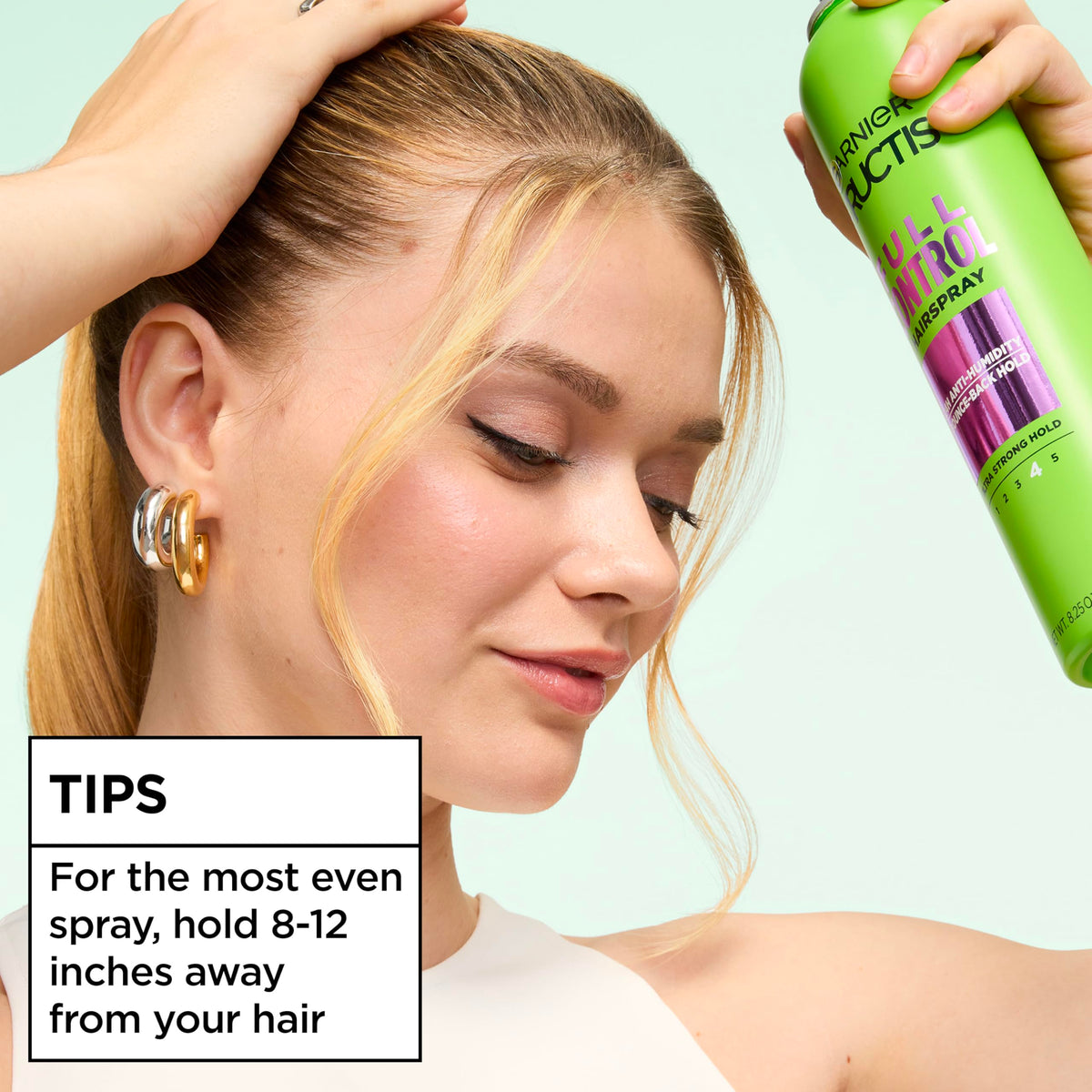 Garnier Fructis Full Control Hairspray showing usage instructions