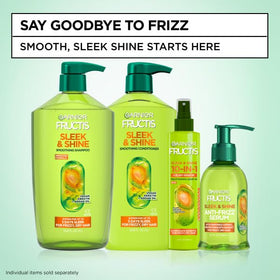 Garnier Fructis Sleek & Shine 10-in-1 Leave In Conditioner Spray on bathroom counter