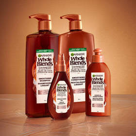Garnier Whole Blends Smoothing Leave-In Conditioner with coconut and cocoa butter background