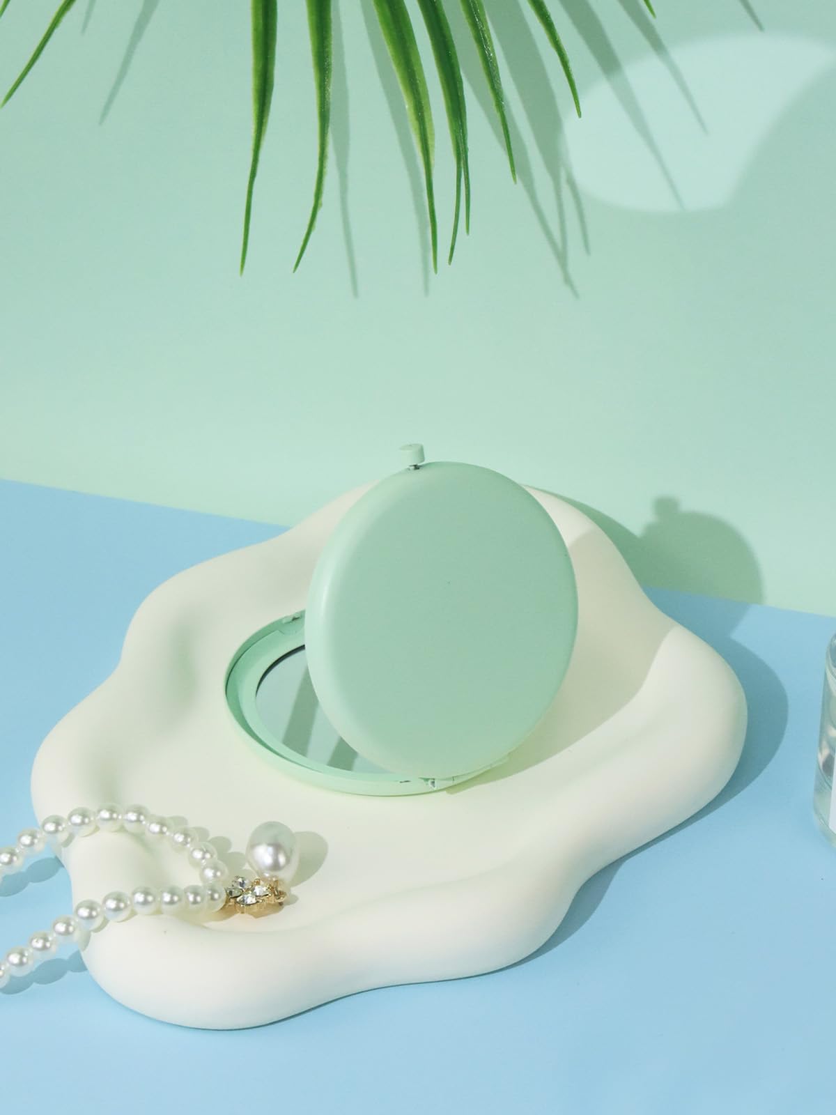 Getinbulk Compact Mirror Cyan with background of beauty products