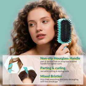 GFDCK Curl Defining Brush on a styling table with hair products