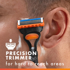 Gillette Fusion5 razor with blade refills on a countertop