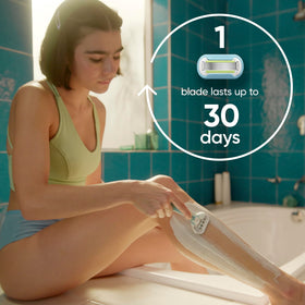 Gillette Venus Extra Smooth razor blade refills on a bathroom shelf