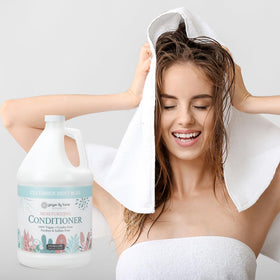 Ginger Lily Farms 1 Gal Moisturizing Conditioner in a spa setting
