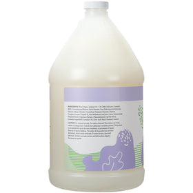 Ginger Lily Farms body wash pouring into a hand