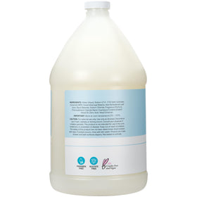 Ginger Lily Farms body wash pouring into a shower dispenser
