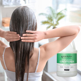 Ginger Lily Farms Moisturizing Conditioner in a bathroom