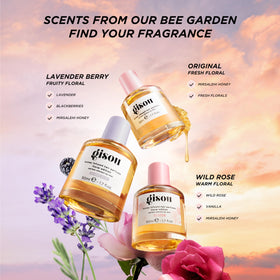 Gisou Honey Infused Hair Perfume Wild Rose on vanity with hairbrush