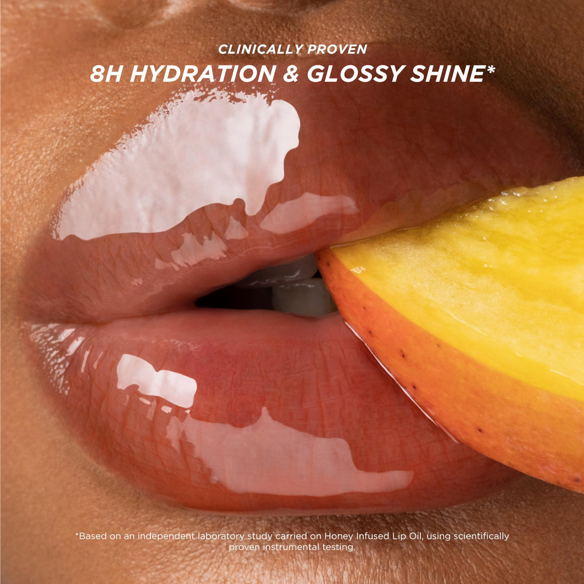 Gisou Honey Infused Lip Oil Mango Passion Punch on lips