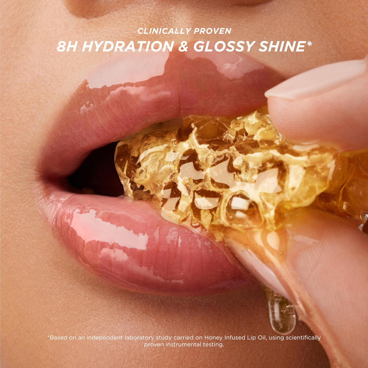 Gisou Honey Infused Lip Oil on bare lips for a glossy finish