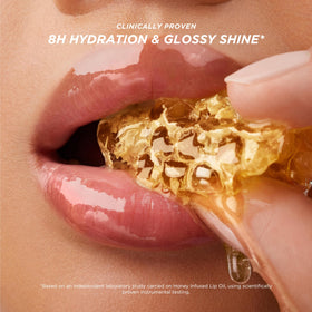 Gisou Honey Infused Lip Oil on bare lips for a glossy finish