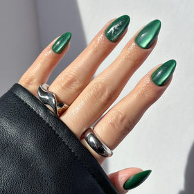 Glamnetic Slytherin Press On Nails set front view with emerald green nails