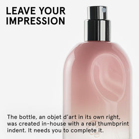 Glossier You Eau de Parfum bottle with pink pepper and iris flowers
