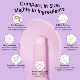 grace & stella Under Eye Brightener Balm Stick on a desk