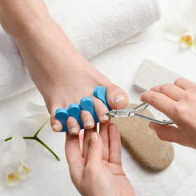 GREEN ESTETICA Cuticle Nipper resting on a nail care kit