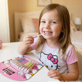 Group of children playing with Townley Girl Hello Kitty lip glosses