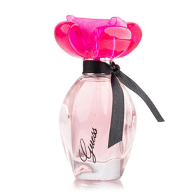 GUESS Girl Eau de Toilette bottle with floral background