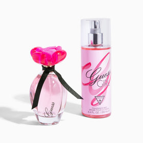 GUESS Girl Eau de Toilette on vanity with flowers