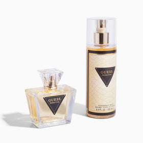 GUESS Seductive Eau de Toilette 75ml with floral background