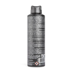 GUESS Seductive Homme Body Spray in hand for application