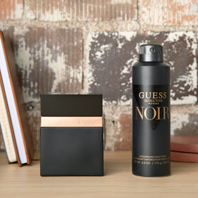 GUESS Seductive Noir Eau de Toilette on a wooden surface
