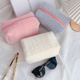 HABUAETY makeup bag with various cosmetic items