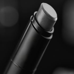 Harry's Black Lip Balm in a grooming kit setting