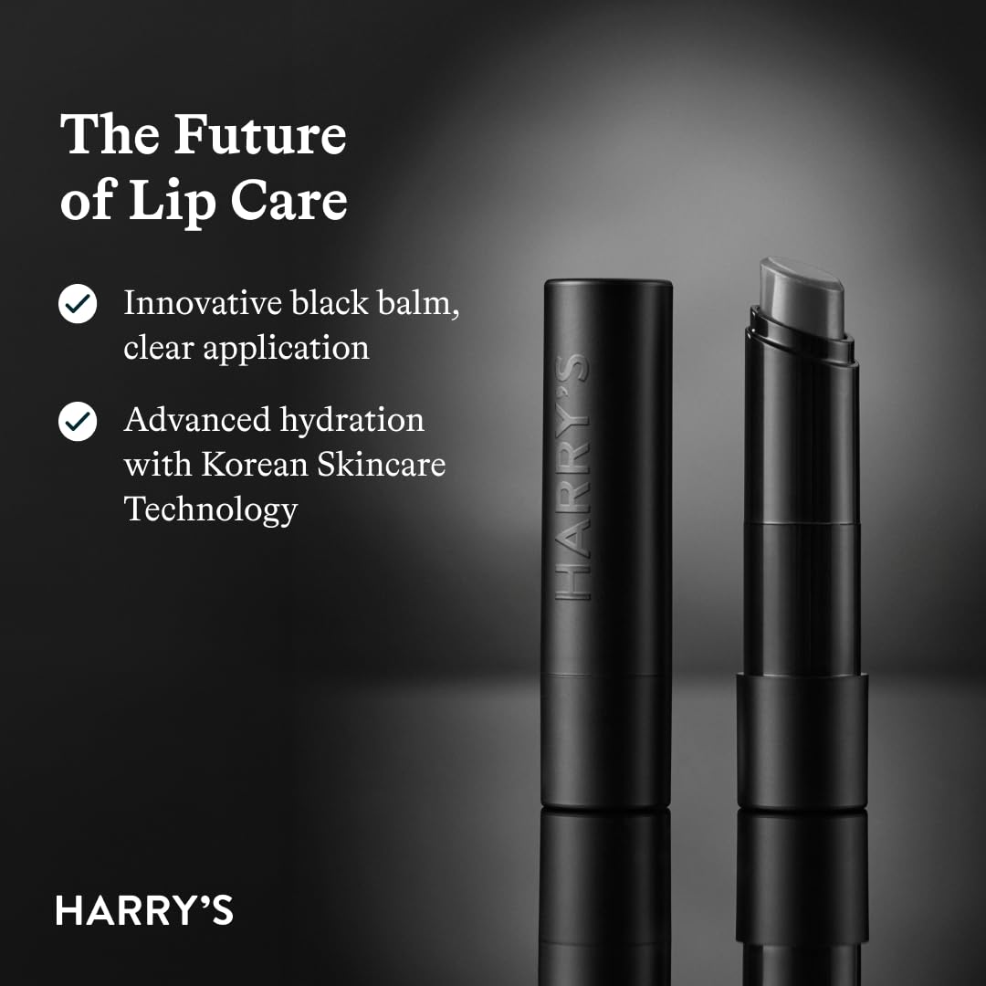 Harry's Black Lip Balm tube on a wooden surface