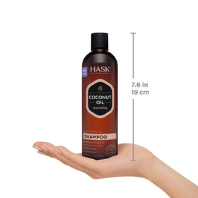 HASK Coconut Shampoo and Conditioner on a bathroom shelf