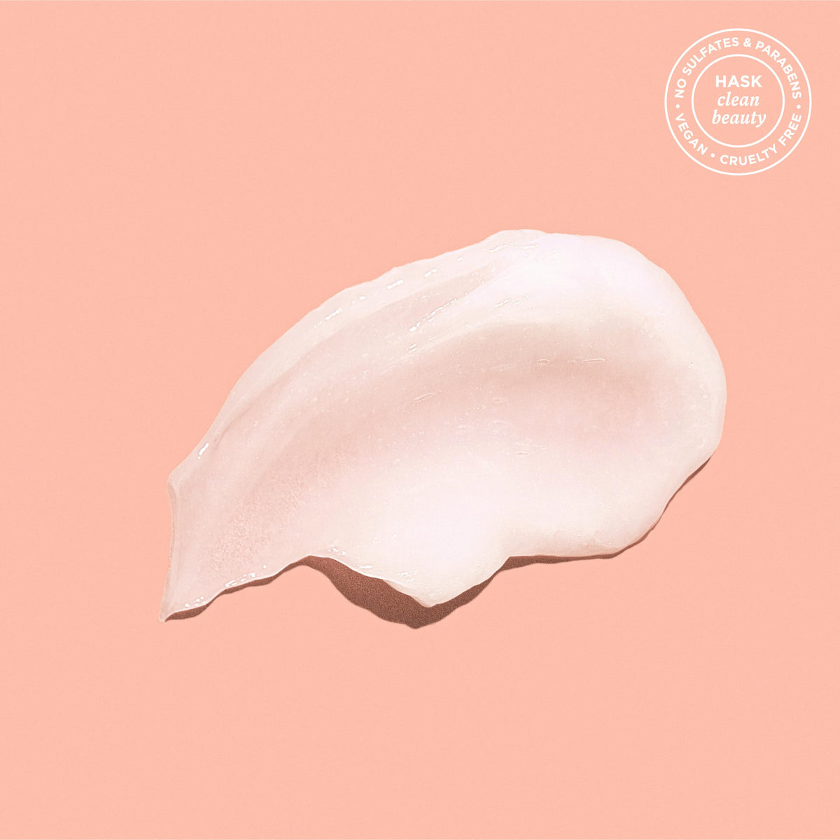 HASK Coconut Shampoo bottle with coconut background