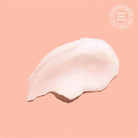 HASK Coconut Shampoo bottle with coconut background
