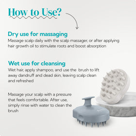 HEETA scalp massager shampoo brush in hand demonstrating grip