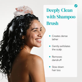 HEETA scalp massager shampoo brush in use on wet hair