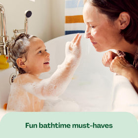 Hello Bello Baby Shampoo & Body Wash in a bath setting with baby