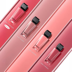 HERA Sensual Nude Lip Gloss #462 SPEECHLESS on a vanity table