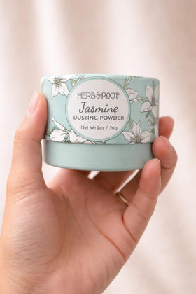 Herb & Root Jasmine Dusting Powder being applied to skin