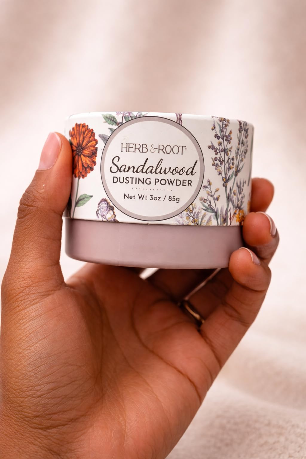 Herb & Root Sandalwood Dusting Powder 2 oz on a bathroom shelf