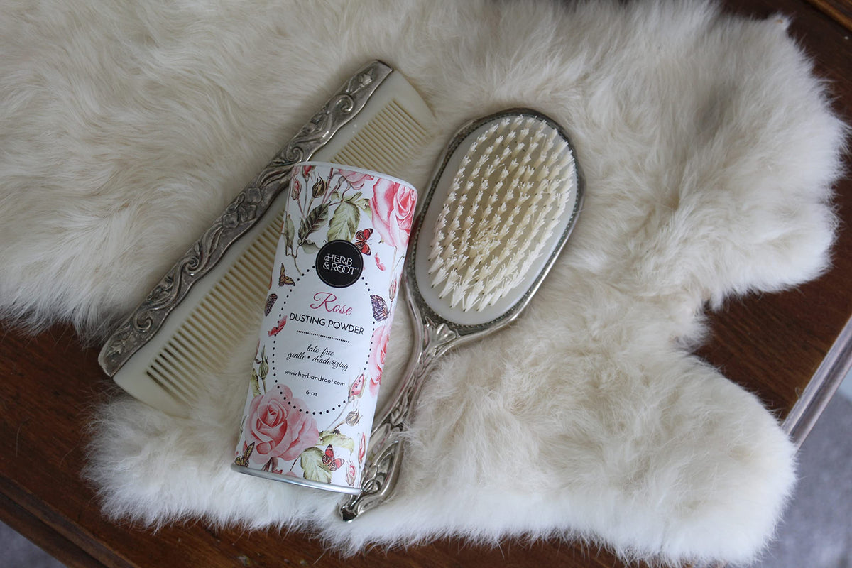 Herb & Root Talc Free Body Dusting Powder Rose on a dressing table