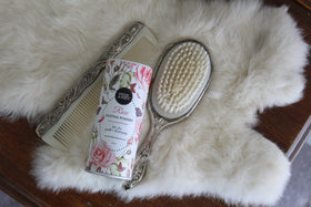 Herb & Root Talc Free Body Dusting Powder Rose on a dressing table