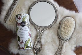 Herb & Root Vanilla Body Dusting Powder on dresser