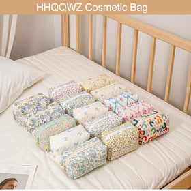 HHQQWZ Cosmetic Bag set on a travel suitcase
